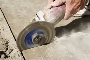 Removing grout and mortar with an angle grinder
