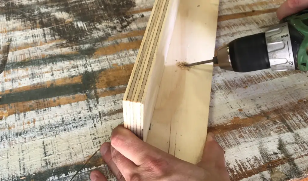 Toe-nailing the screw in at an angle - start upright then tilt the bit once it has bitten into the wood