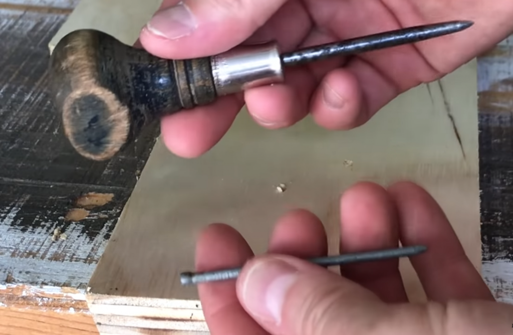 Use an awl or naill to punch the hole location